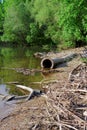 Large pipes running into the lake Royalty Free Stock Photo