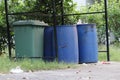 Large plastic bins are set up in the garbage dump in the village. Royalty Free Stock Photo