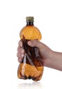 Large plastic bottle squeezed in a hand