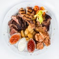 Large plate with grilled meat top view Royalty Free Stock Photo