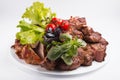 A large plate of meat assorted cooked on a grill Royalty Free Stock Photo