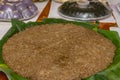 A large platter of biko on banana leaves. A local Filipino dish made with glutinous rice Royalty Free Stock Photo