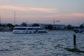 A large pleasure boat floats on the Chao Phraya river in the late evening Royalty Free Stock Photo