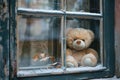 Large plush teddy bear with a bow peering through an old, weathered window. Royalty Free Stock Photo
