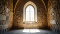 Gothic arched window in stone wall with sunlight streaming through Royalty Free Stock Photo