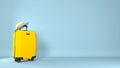 Large polycarbonate suitcase and hat on color background Royalty Free Stock Photo