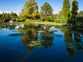 Large pond with water lilies in an italian public park. Royalty Free Stock Photo