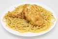 Chicken Francese and Spaghetti on a White Plate