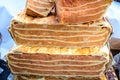 Large portions of freshly home cooked pumpkin pie in display on a table at a street food market, side view photograph of healthy v