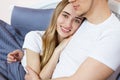 Large portrait : Young lovely couple on bed, morning bedroom. Happy loving couple in the bedroom in morning Copy space . Family Royalty Free Stock Photo