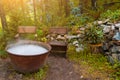 A large pot or pan over a fire while preparing a potion or meal, evaporating a large amount of steam while boiling water on autumn Royalty Free Stock Photo