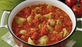 A large pot of vegetable soup with tomatoes and cabbage Royalty Free Stock Photo
