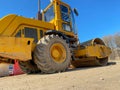 Large powerful modern yellow roller for asphalt paving, repair and road construction. New construction machinery and equipment at Royalty Free Stock Photo