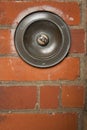 Large press button doorbell brick wall Royalty Free Stock Photo