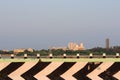 Large private modern buildings near the salt water lake across the road, India