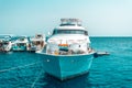 A large private motor yacht under way sailing out on tropical sea. Royalty Free Stock Photo