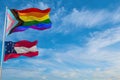 large progress lgbtq flag and flag of the Confederate States of America May July 1861 waving in the wind at cloudy sky. Freedom