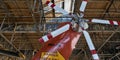 large propeller on vintage plane helicopter being restored (new paint) inside airplane hanger antique Royalty Free Stock Photo