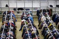 Large public locker room with clothes at an event