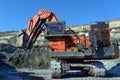 Large quarry dump truck. Loading the rock in the dumper. Loading Royalty Free Stock Photo