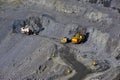 Large quarry dump truck. Loading the rock in the dumper. Loading coal into body work truck Royalty Free Stock Photo