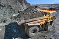 Large quarry dump truck. Loading the rock in the dumper. Loading Royalty Free Stock Photo