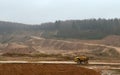Large quarry dump truck. View of the large sand pit. Production useful minerals. Royalty Free Stock Photo