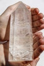 Large quartz crystal in hands Royalty Free Stock Photo