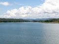 The large quiet lake of the long rock dam in the valley Royalty Free Stock Photo