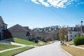 Large and quiet residential street in downhill upscale neighborhood with two and three story new development suburban single Royalty Free Stock Photo