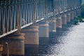 Large railway bridge with concrete supports over the river Royalty Free Stock Photo
