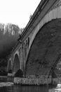 Large railway bridge with stone arches.