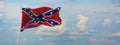 Large rebel flag waving in the wind . the Confederate battle or Dixie flag. Stars and Bars. Vintage United States flag. panoramic