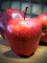 A large red apple of the Red Chief variety, a close-up shot. Water droplets on the apple peel. Ripe fruit Royalty Free Stock Photo