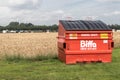 Large red Biffa General Waste container garbage rubish bin in a field Royalty Free Stock Photo