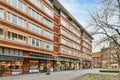 a large red brick building with a street in front Royalty Free Stock Photo