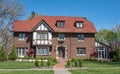 Large Red Brick English Tutor House in Early Springtime Royalty Free Stock Photo