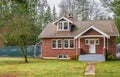 Large Red Brick Traditional Colonial Home House. Brick Facade of the Old private dwelling house Royalty Free Stock Photo