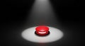 A large red button is illuminated by a spotlight on a dark background Royalty Free Stock Photo