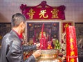 Large red candles are lit at the temples to celebrate Chinese New Year.
