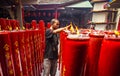 Large red candles are lit at the temples to celebrate Chinese New Year.