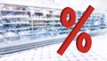 Large red 3d Percentage sign on blur image of supermarket background. Rising food price. Inflation concept. Retail industry. Stock