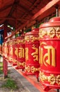 large red elegant Buddhist Prayer wheel, St. Petersburg Buddhist temple