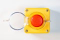 Large red emergency stop button see from above, top view, with open cover, industrial workplace safety, heavy-duty machine stop Royalty Free Stock Photo