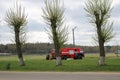 A large red fire rescue vehicle, a fire extinguishing truck, rides on a chemical, oil refinery Royalty Free Stock Photo