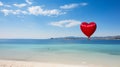 A large, red, heart-shaped balloon high in the clouds over a blue lagoon in the sea. Emotions, balloonists, extreme