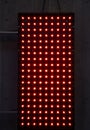 Bright Red LED Panel Display With Grid of Lights Mounted on Industrial Concrete Wall Royalty Free Stock Photo