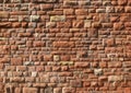 Large red old sandstone wall with rough textured surface Royalty Free Stock Photo