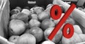 Large red Percentage sign on apples in box background. Rising food price. Inflation concept. Retail industry. Finance Economy.