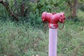 Large red steel pipe, water supply fire suppression system located outdoors. Royalty Free Stock Photo